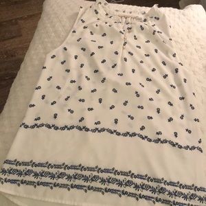 Cream and blue sleeveless shell.